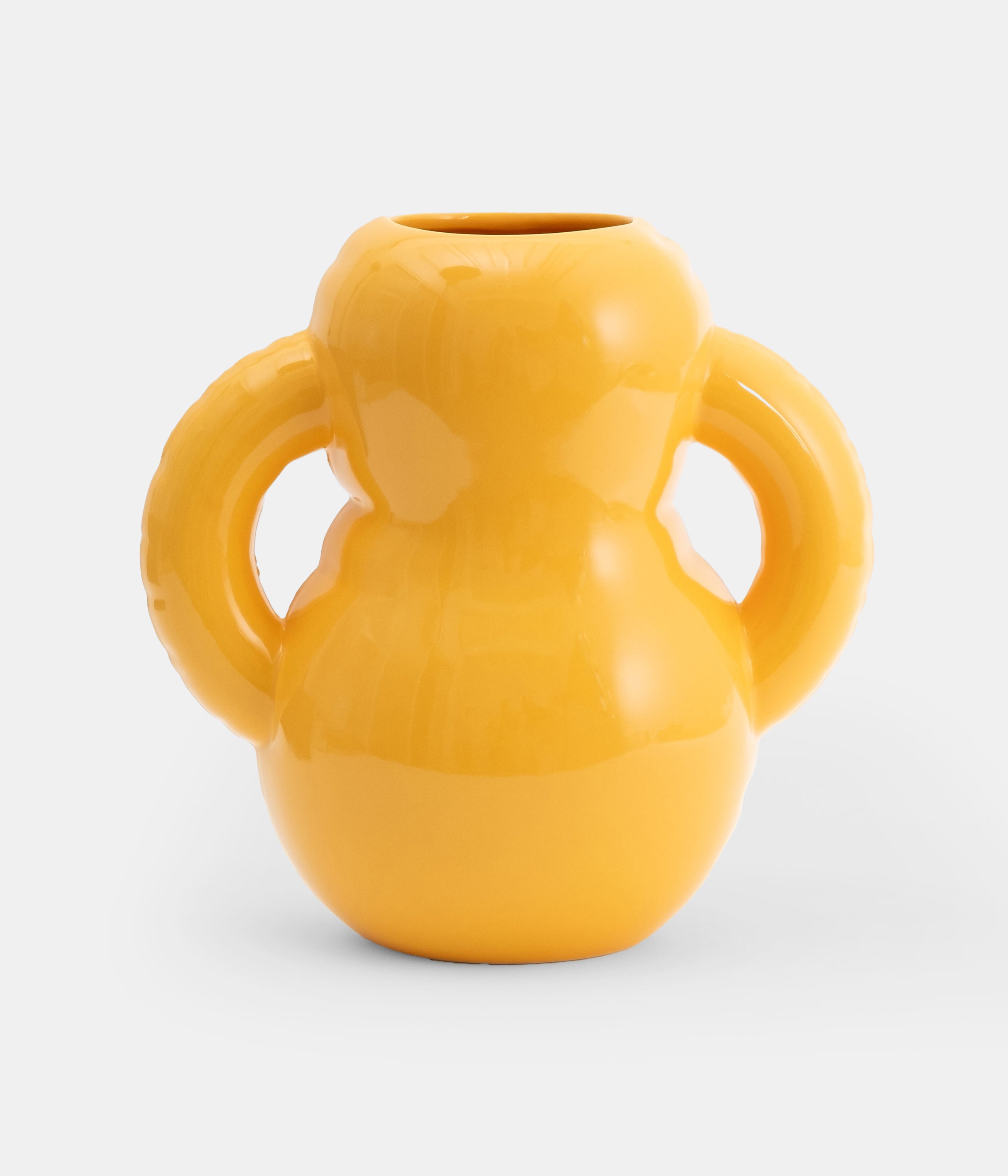 Home Studyo vase in yolk on white background